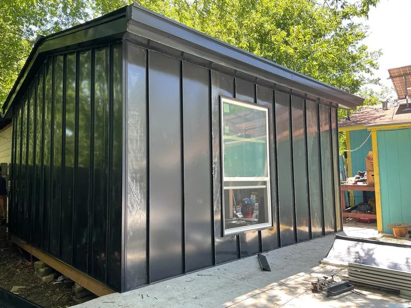 Black standing seam metal wall panels for Roof Inspection in Cinco Ranch