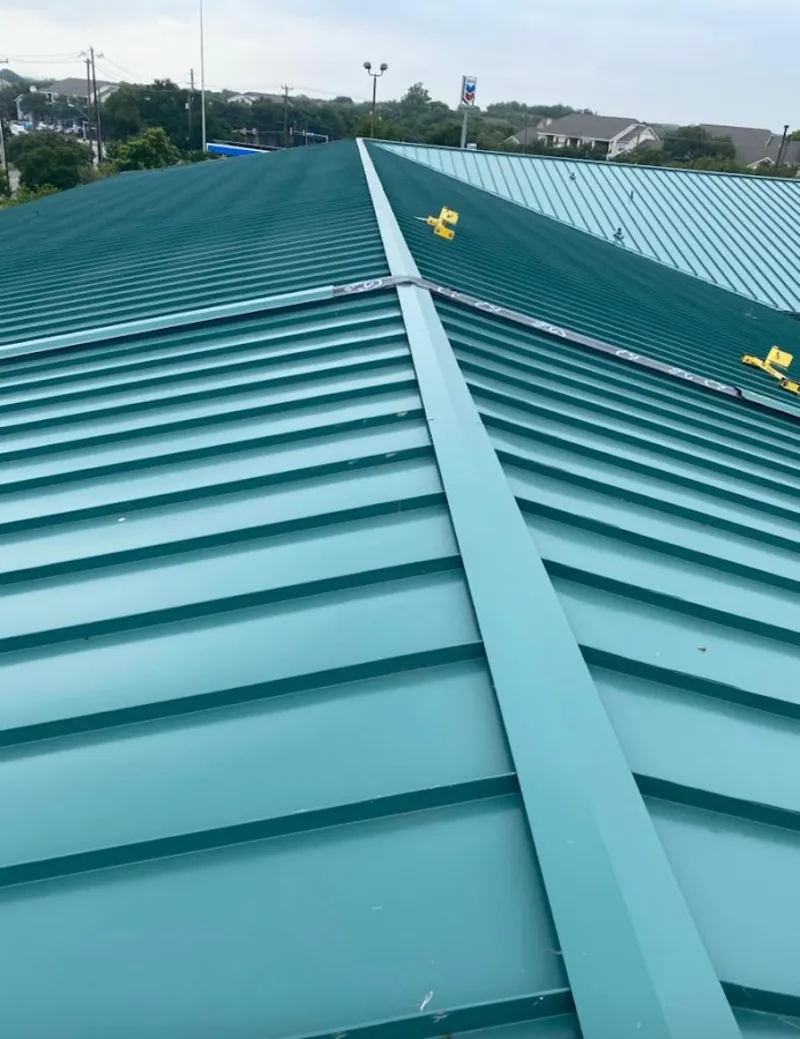 Green commercial metal roof ridge and valley for Metal Roof Repair in Cinco Ranch